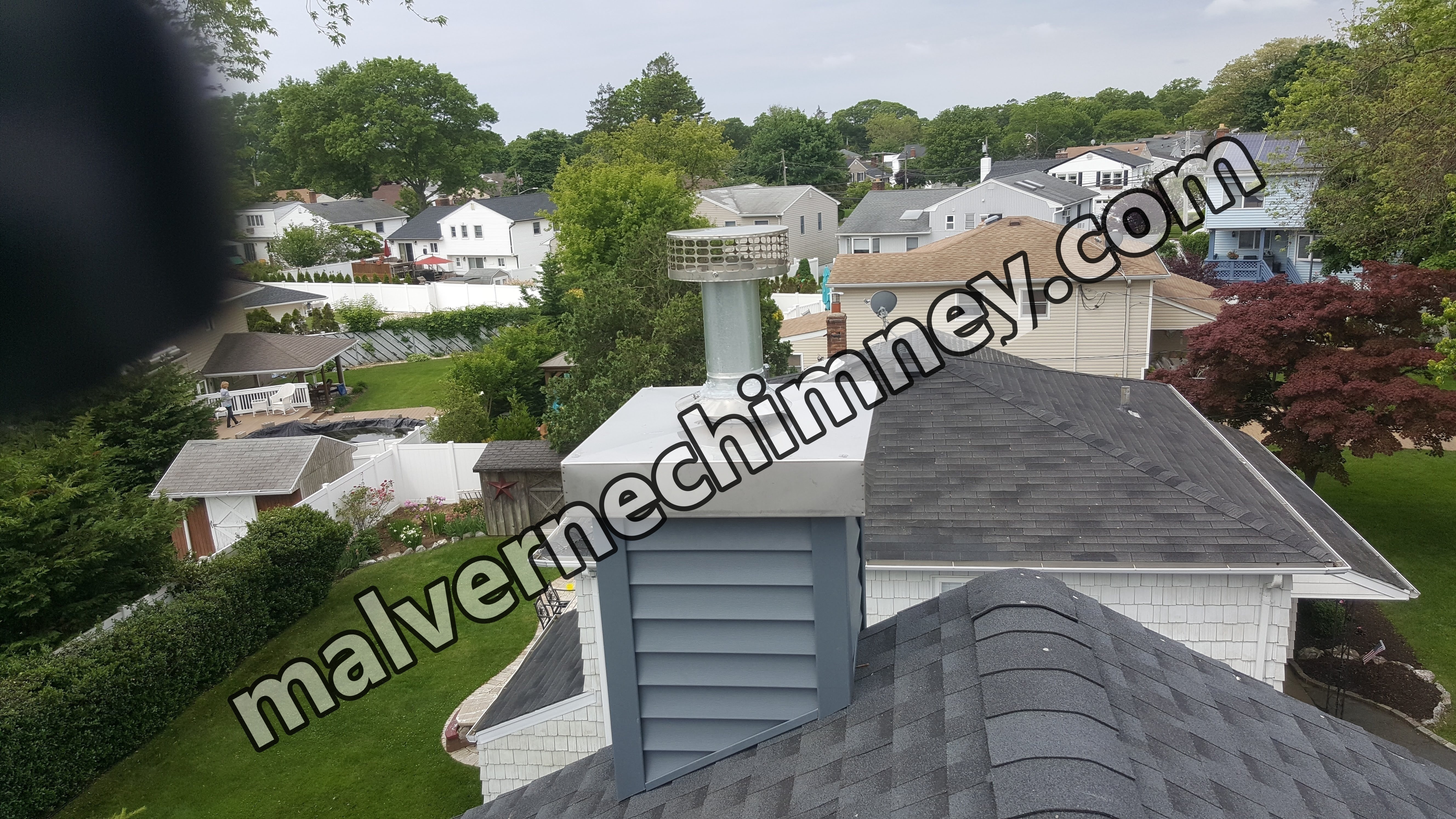 Complete chimney crown rebuild and waterproofing in Malverne, New York